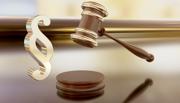 Bild som visar en paragraf i guld och en mötesklubba.