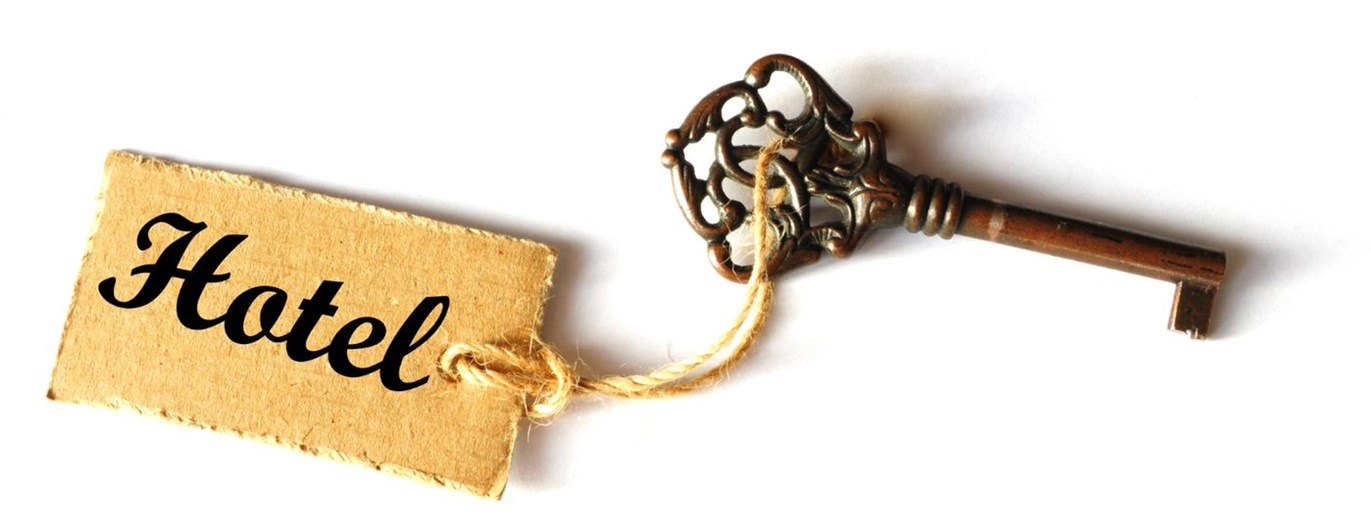 Bild som visar en gammaldags hotellnyckel.